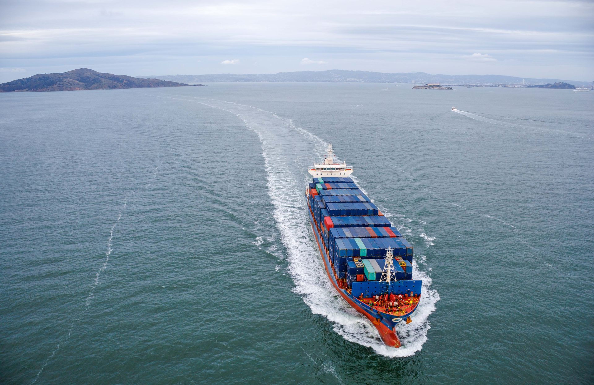 Loaded container ship sailing into San Francisco Bay past Alcatraz